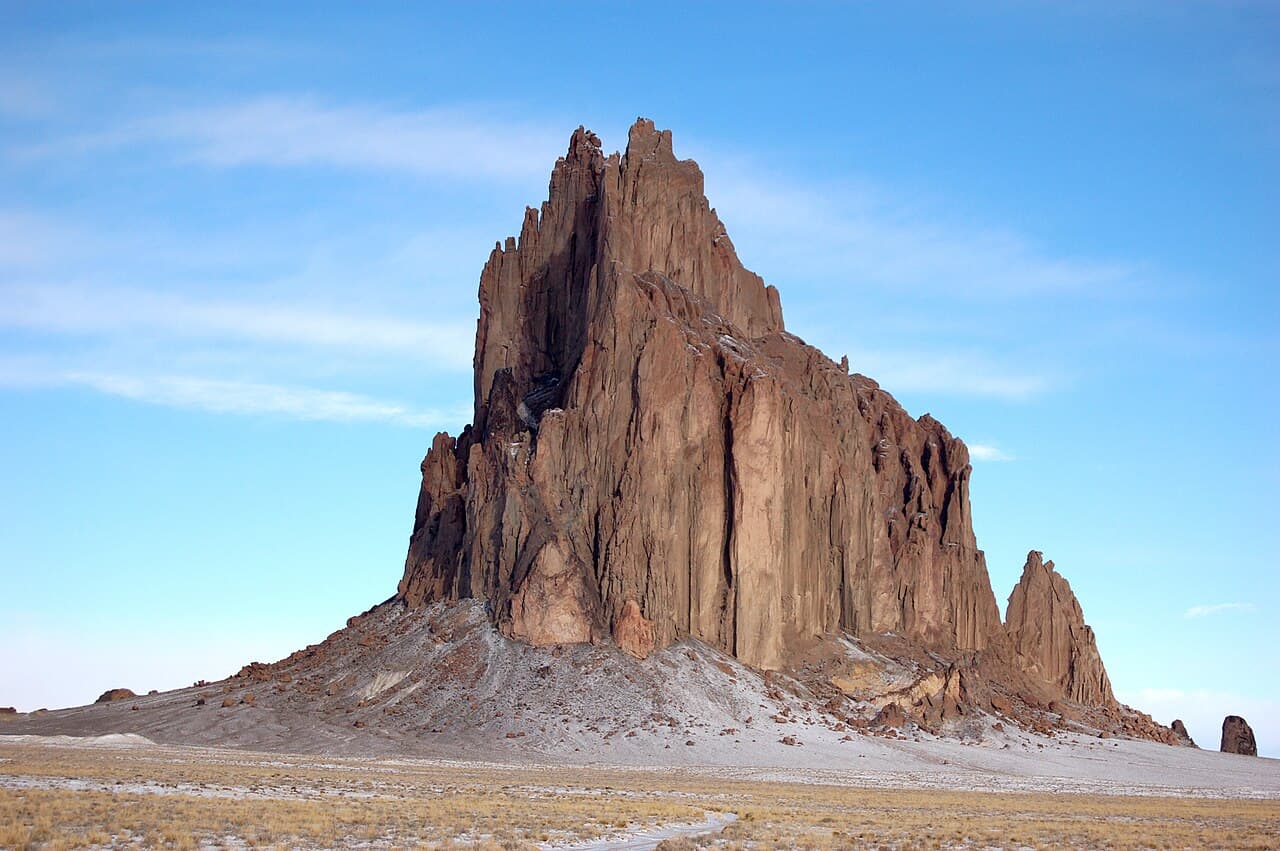 The Shiprock formation rising from the desert plain.