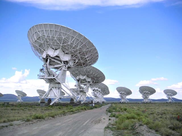 Radio telescope dishes of the Very Large Array on the plains.
