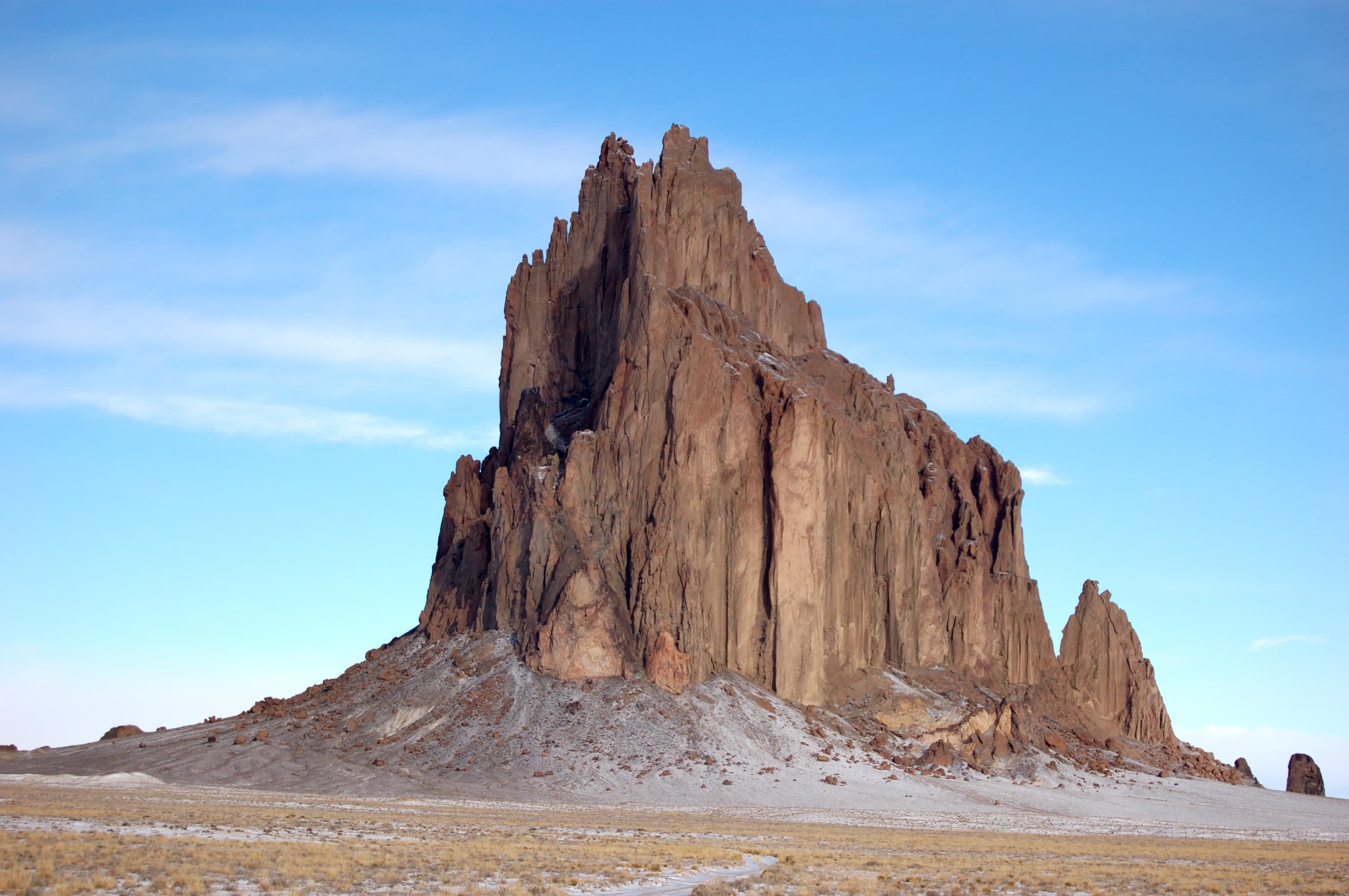 Shiprock volcanic rock formation rising from the desert floor